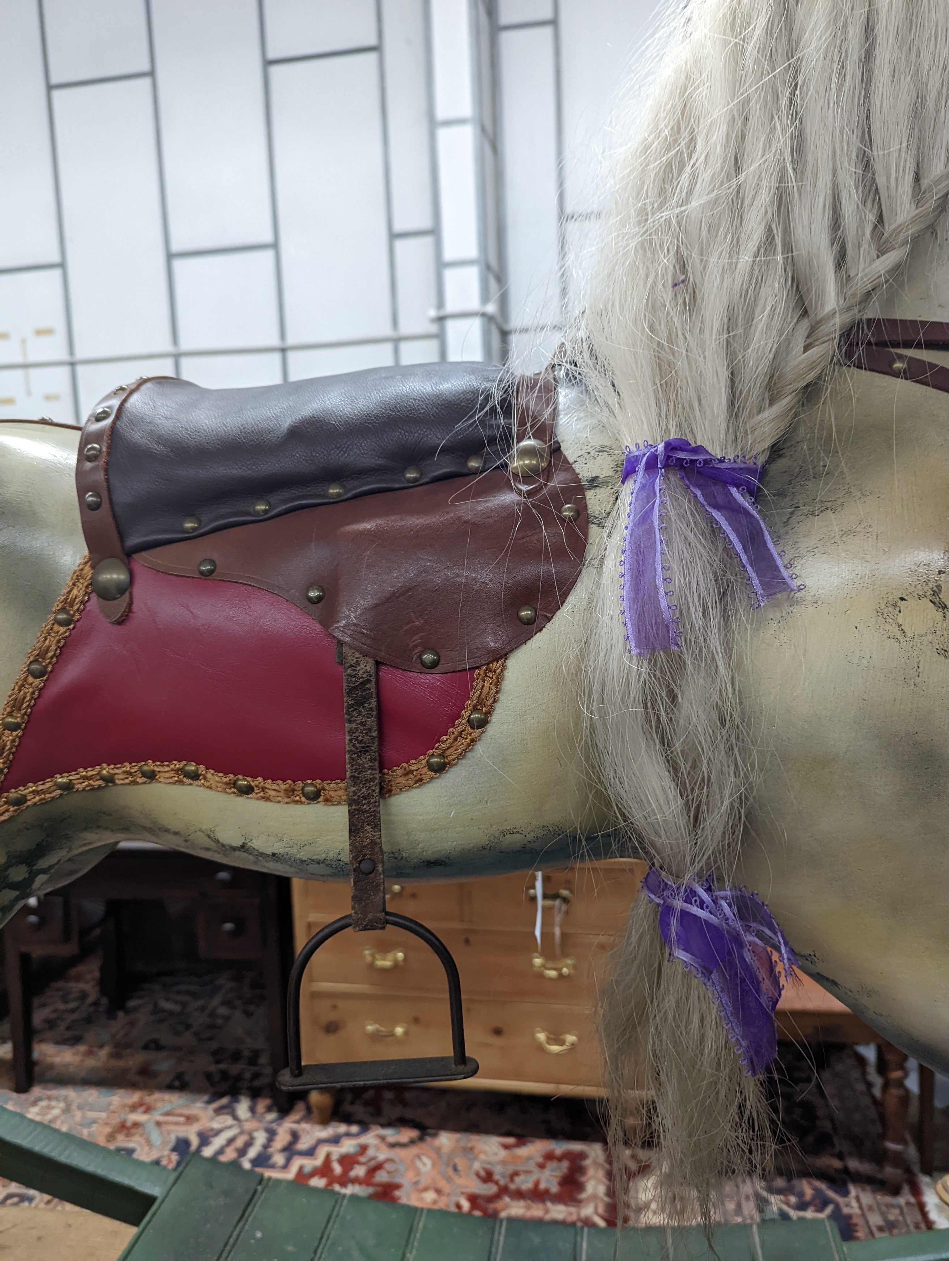 A large Victorian style painted rocking horse with end seats, length 240cm, height 132cm